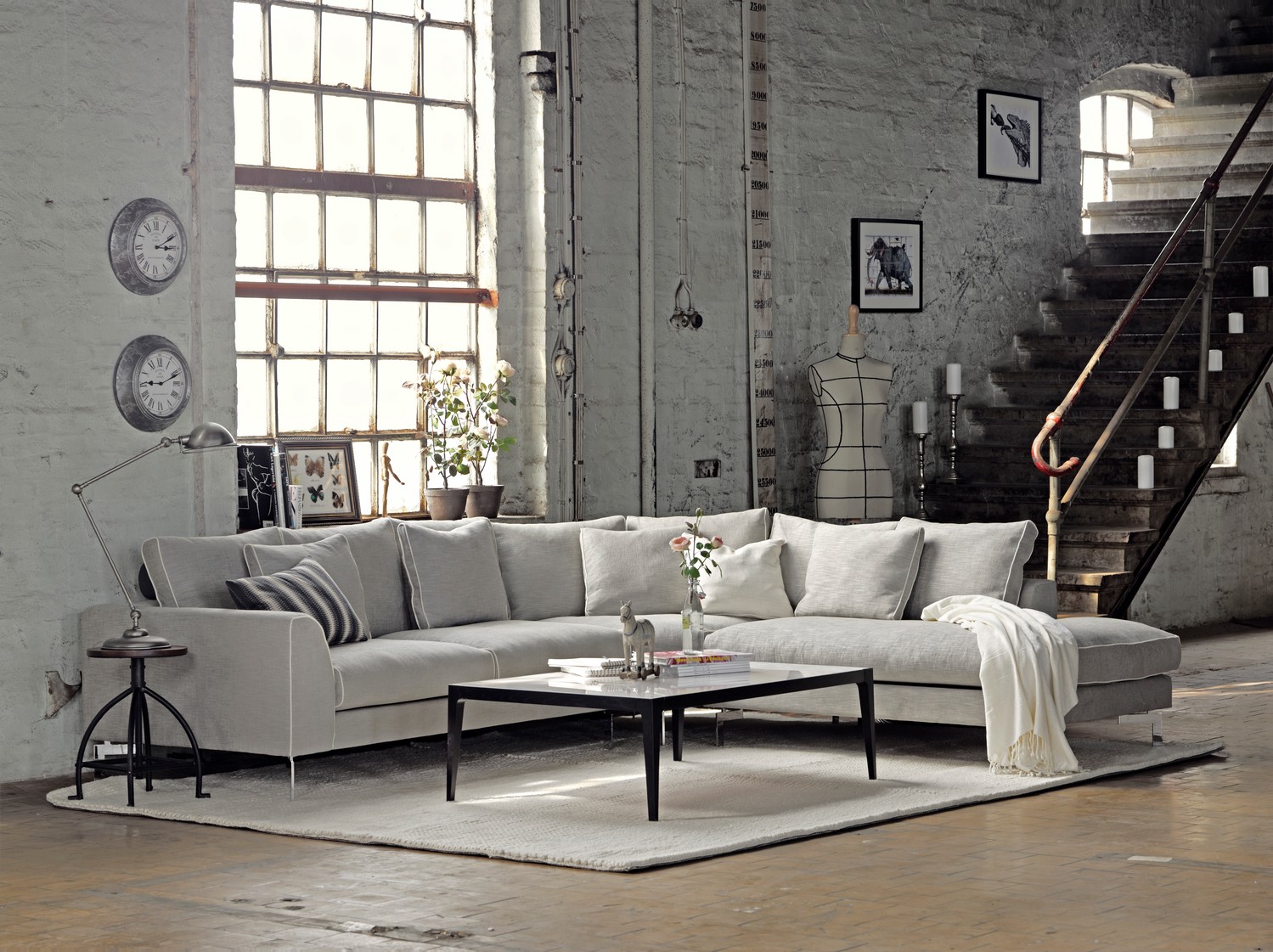 Stunning modern corner Sofa Blues from SOUL furniture store Dublin. Light grey fabric, scatter cushion back create luxury interior