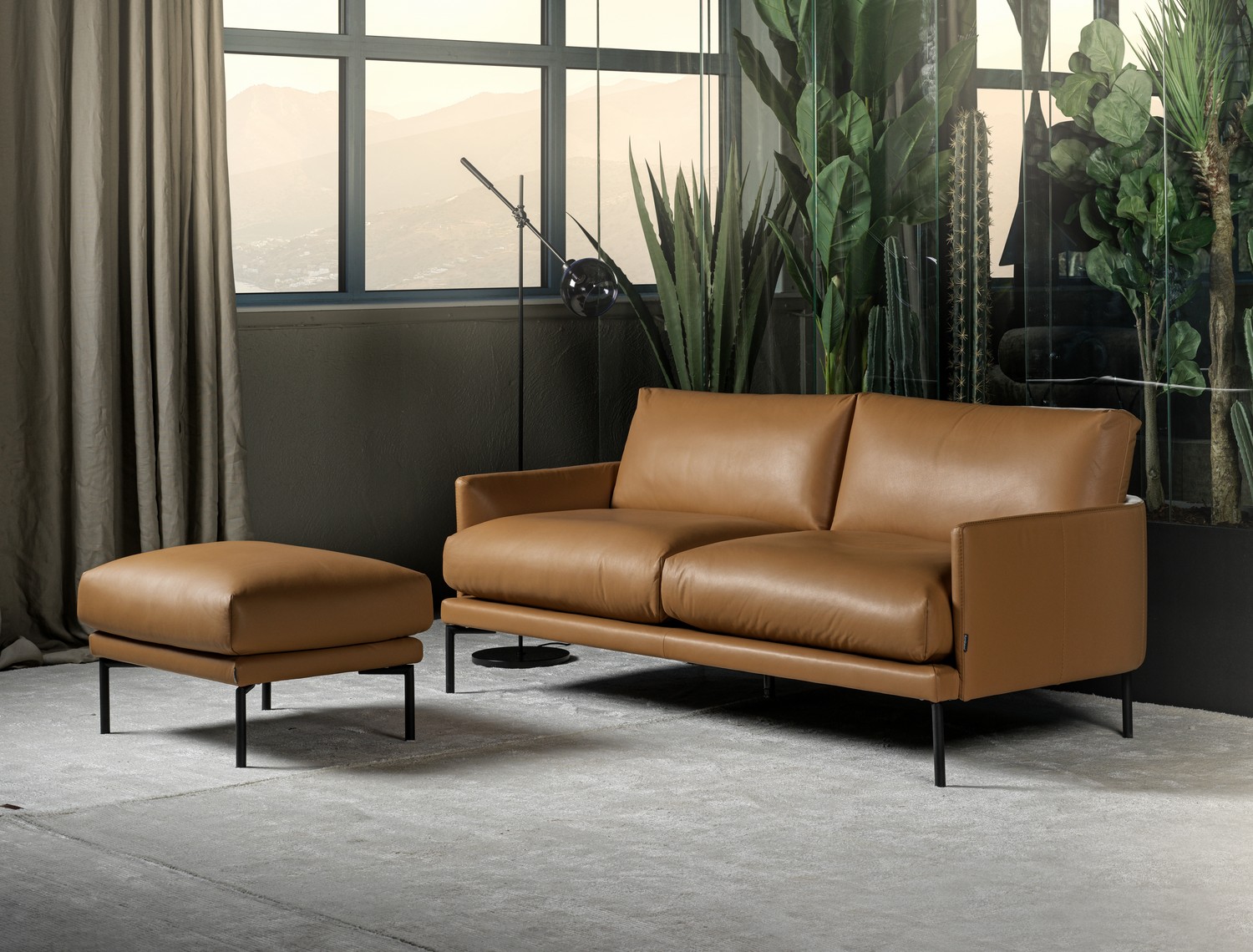 Ravel Sofa, curved shape back, slim sofa. Contemporary look ,tan leather . SOUL Furniture Sandyford Dublin